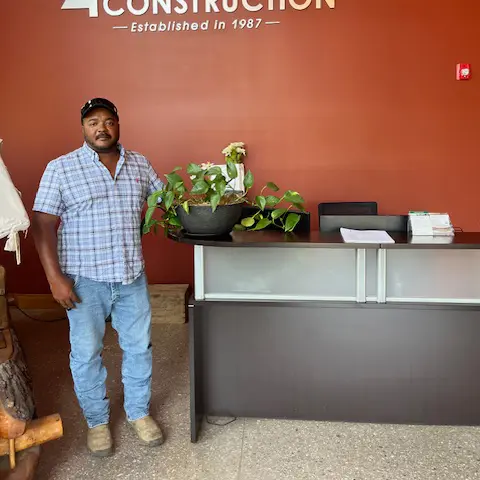 Project Manager, Rod Wright, standing in an office.