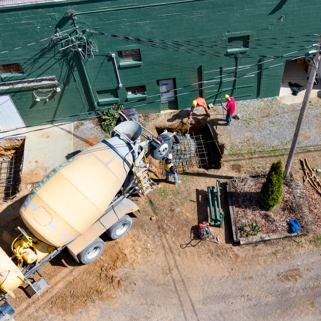 Aerial photo of Pine Knoll crew doing site work and site prep for concrete services and concrete footers.