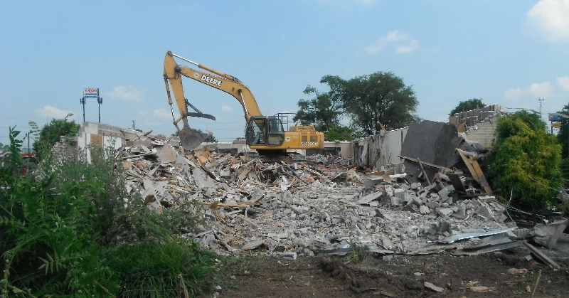 Demolition services being completed by a pine knoll construction excavator in Winchester, VA.