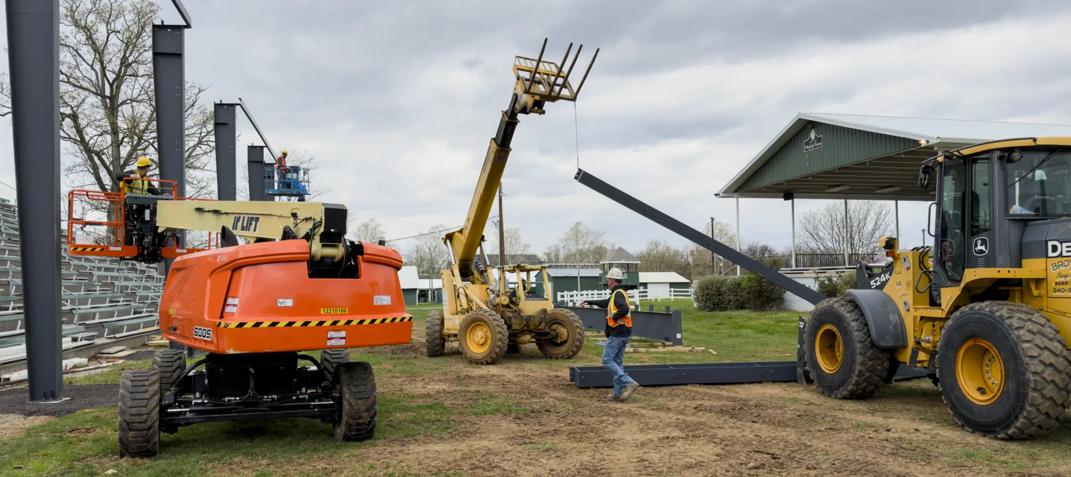 Pine Knoll Construction Crew working to complete site work with large machinery and equipment.