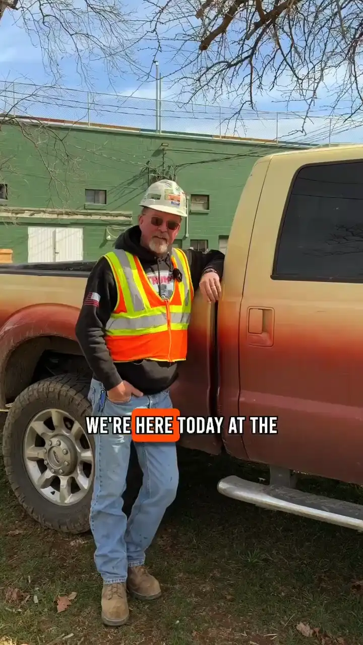 Jeff Jenkins standing at the Clarke County Fairgrounds project showcasing the footers they are putting in.